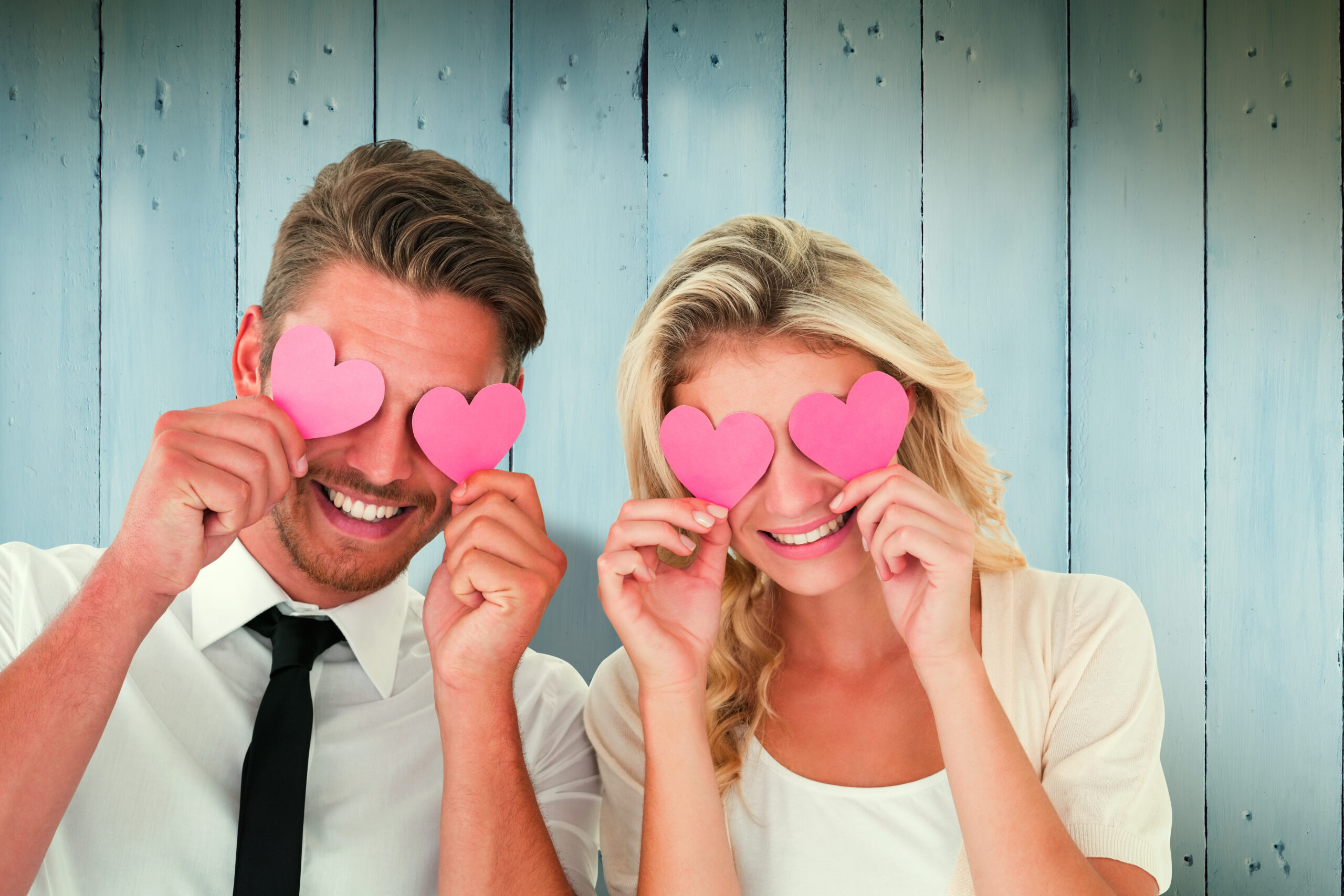 Best matchmaking agency in Singapore - Couple holding pink hearts